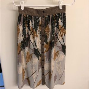 Edme & Esyllte mid-length, botanical print skirt.